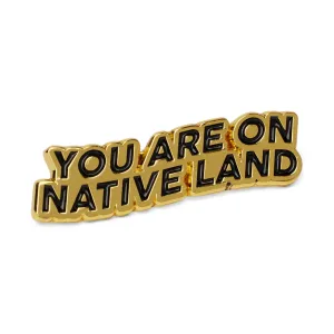 'YOU ARE ON NATIVE LAND' PIN - GOLD